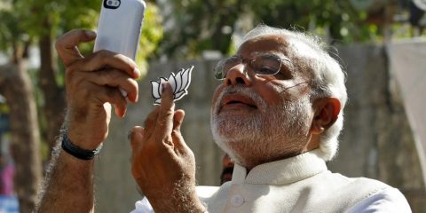 Indian prime minister candidate Narendra Modi takes a "selfie" with a mobile phone after casting his vote at a polling station during India's general election in the western Indian city of Ahmedabad on April 30, 2014. (Amit Dave/Reuters)