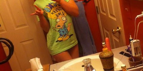 Don't you like my t-shirt with the cool cartoon on it. Always check the reflection before posting! It can spare you a lot of odd conversations you probably never want to have in the first place. This girl probably learned the hard way when her... ahem... massager... ended up on all her friends' timelines.