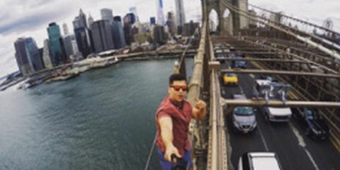 A Tennessee college student was arrested after he took this selfie on an unauthorized section of the Brooklyn Bridge in June 2015.