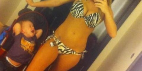 The look on this kids face says it all. He's had enough and is probably a little jealous he's not getting the attention he deserves. Maybe he should help his Mum and take the tag off the  bikini.